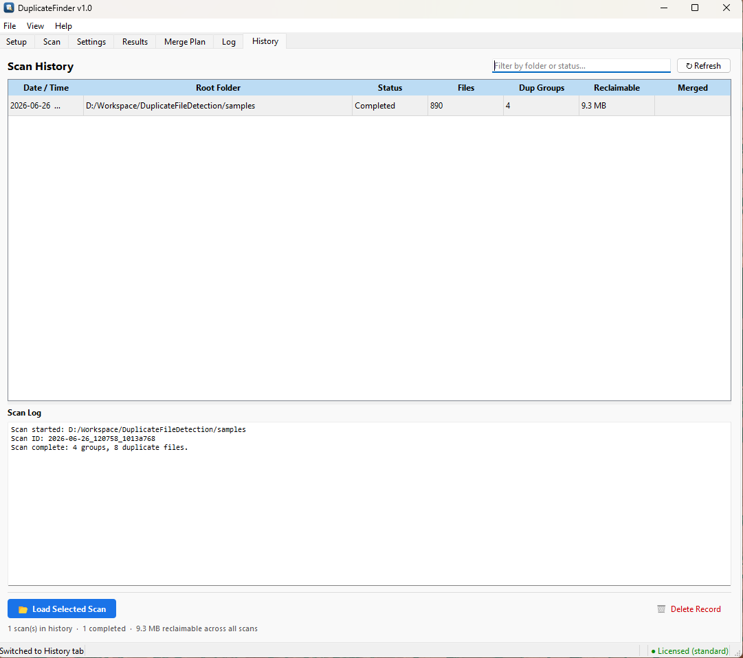Scan History tab listing past scans with date, root folder, status, file count, duplicate groups, and reclaimable space columns